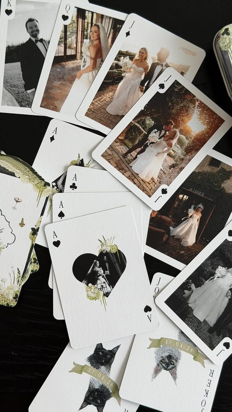Custom playing cards featuring wedding photos of a couple and their pets.