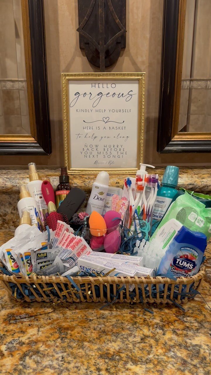Wicker basket filled with toiletries and a framed welcome sign on granite countertop