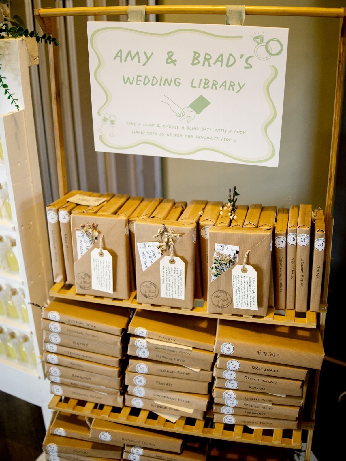 Wooden shelf with brown wrapped books and a wedding library sign.