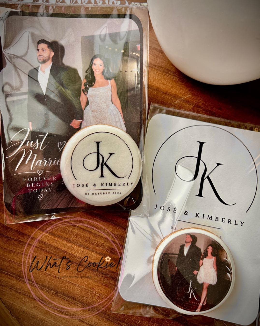 Personalized round sugar cookies featuring a couple's photo and initials for a wedding.
