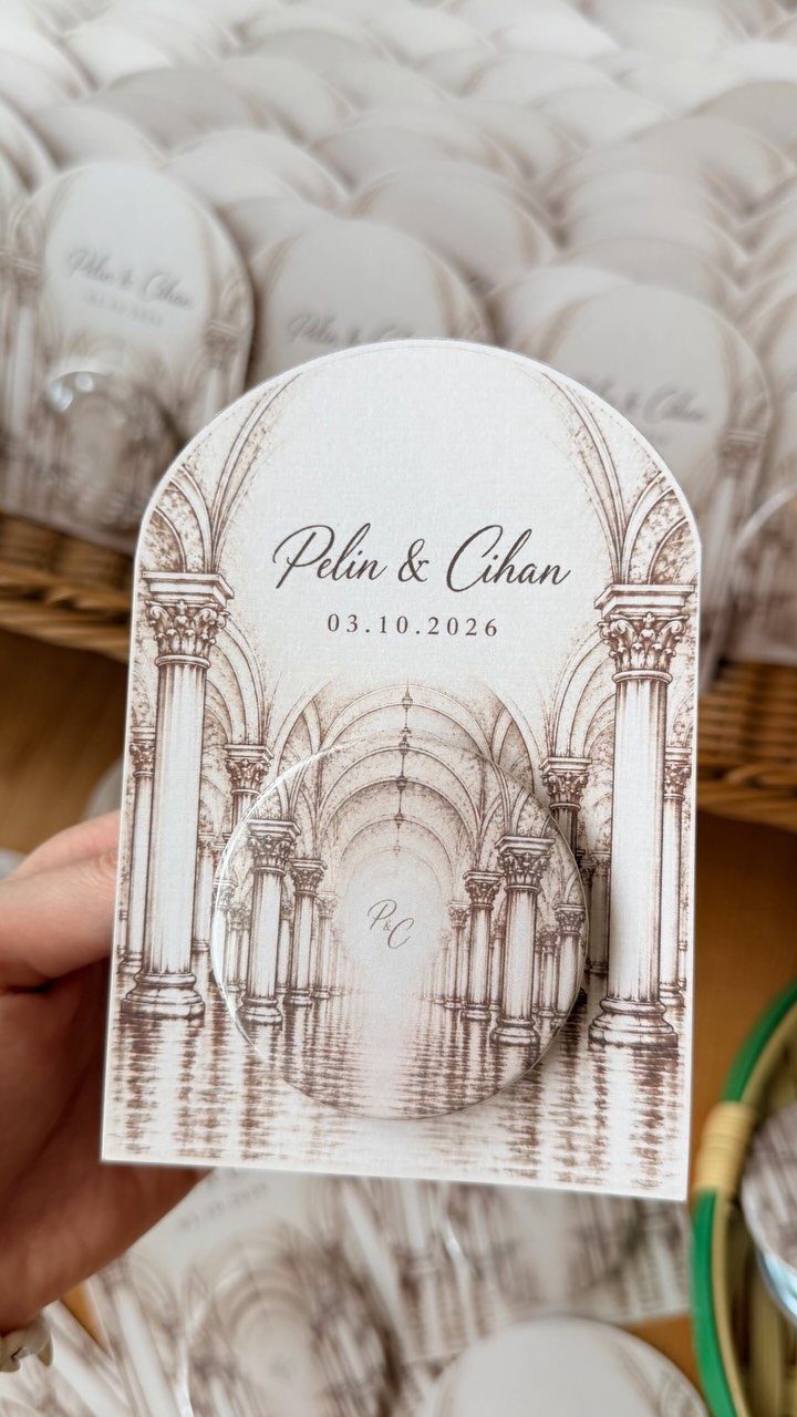 Arched wedding favor card with a small circular personalized acrylic magnet attached.