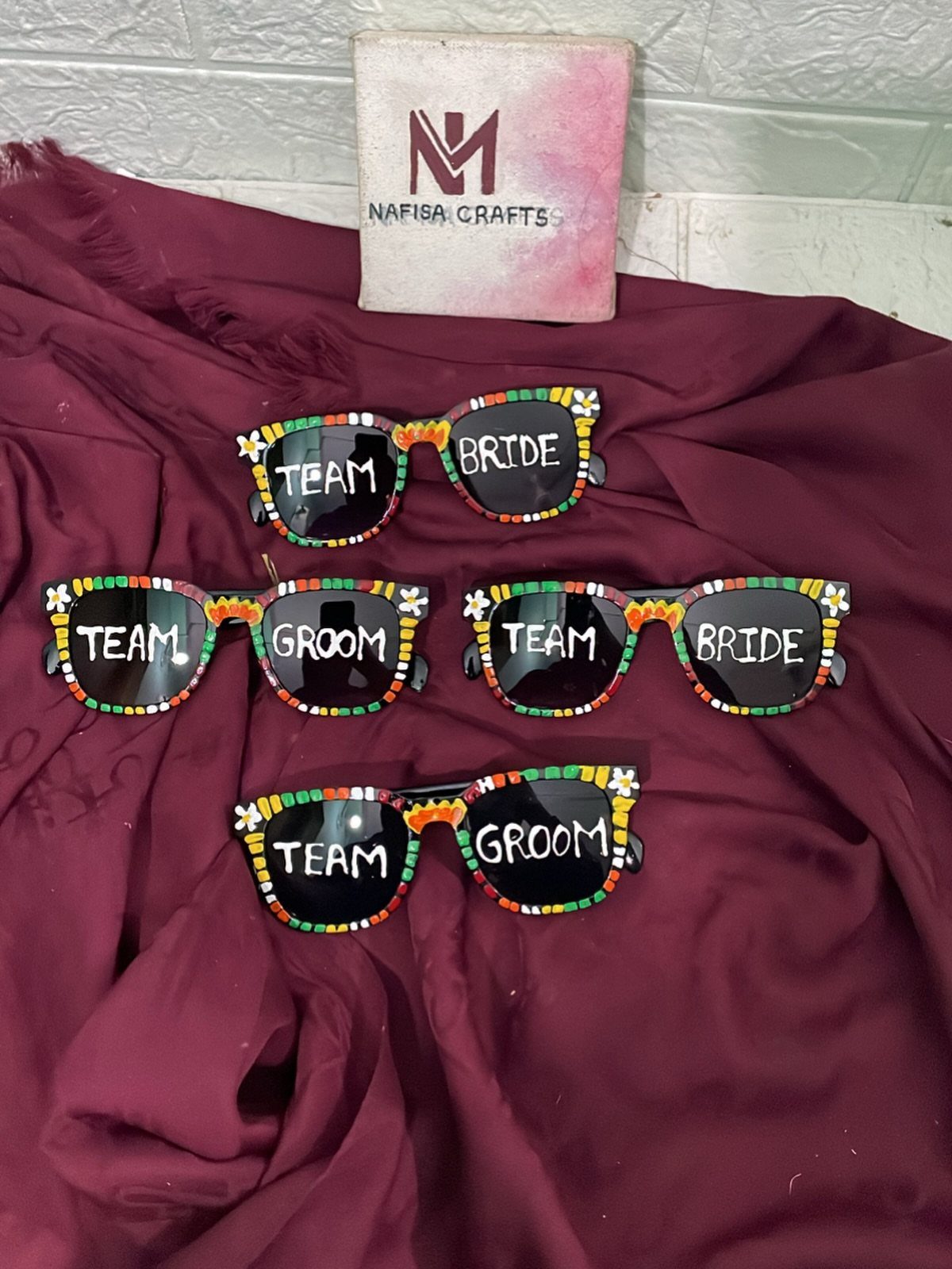 Four pairs of beaded sunglasses with Team Bride and Team Groom text on lenses.