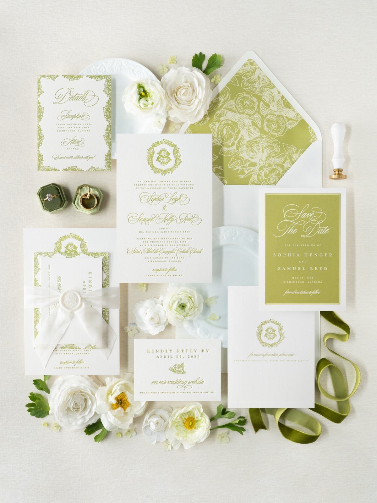 Ivory wedding invitation suite with green floral accents and white ranunculus flowers