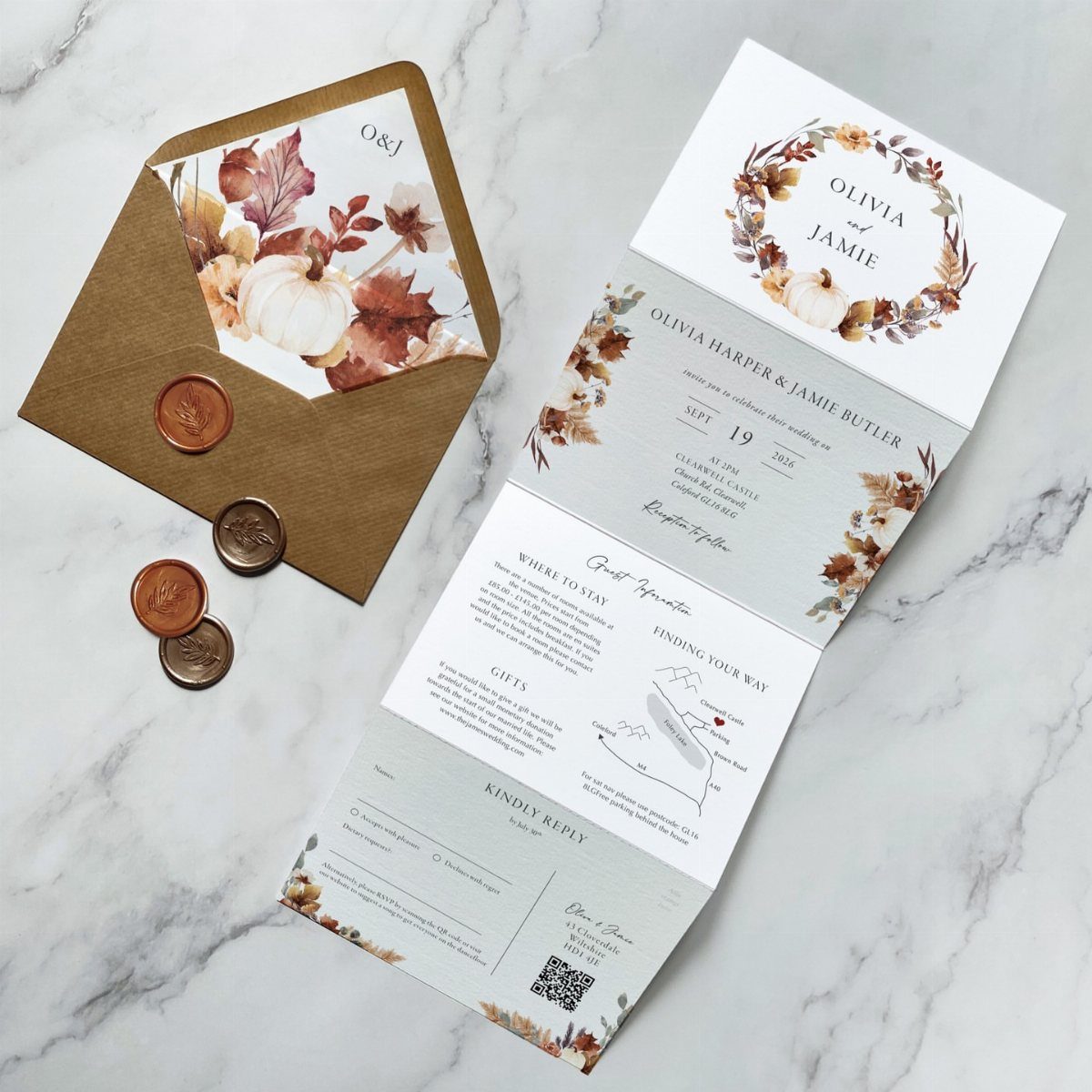 Wedding invitation suite with watercolor autumn leaves and pumpkins on marble background
