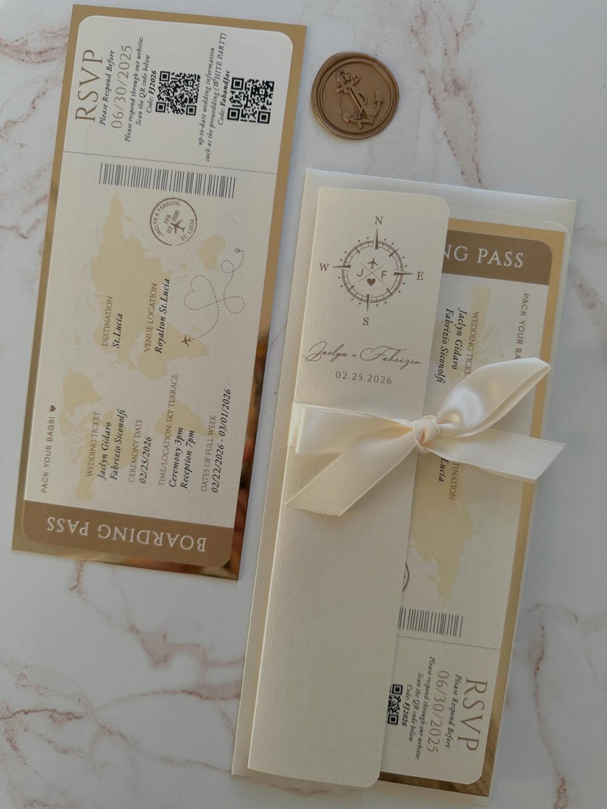 Boarding pass wedding invitations with a compass, map, and white satin ribbon.