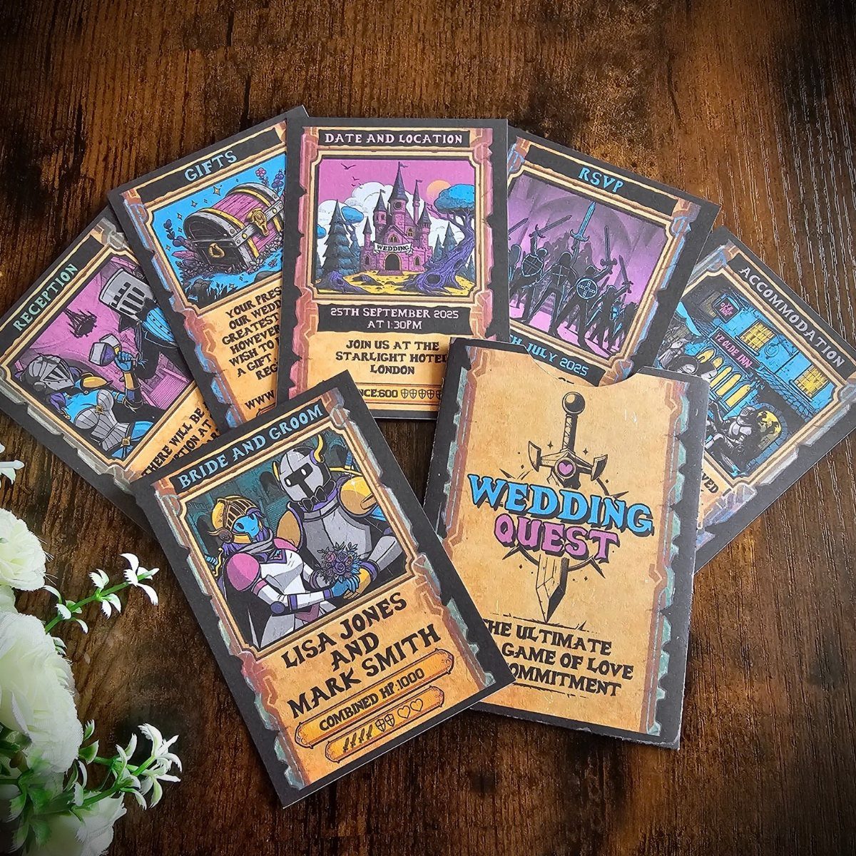 Fantasy board game themed wedding invitations with colorful illustrations on a wooden table