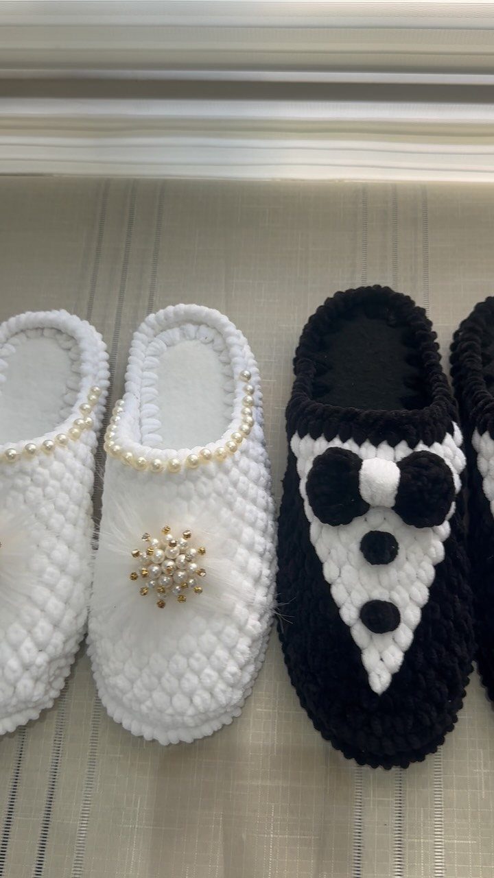 Crochet wedding slippers featuring a white bridal design with pearls and a tuxedo groom design.