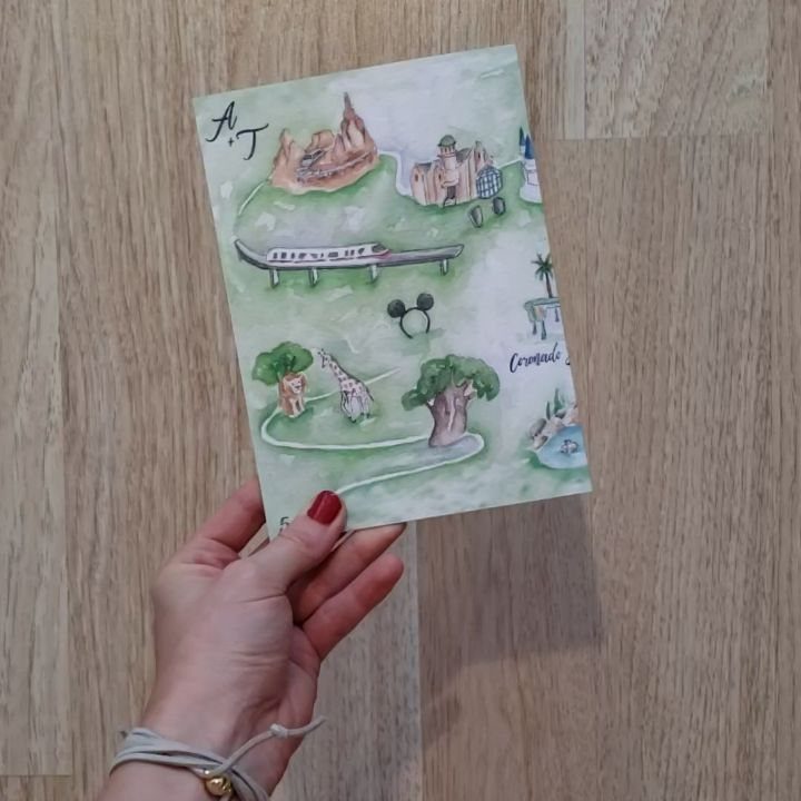 Watercolor map invitation featuring a Disney castle, monorail, and Mickey Mouse silhouette.