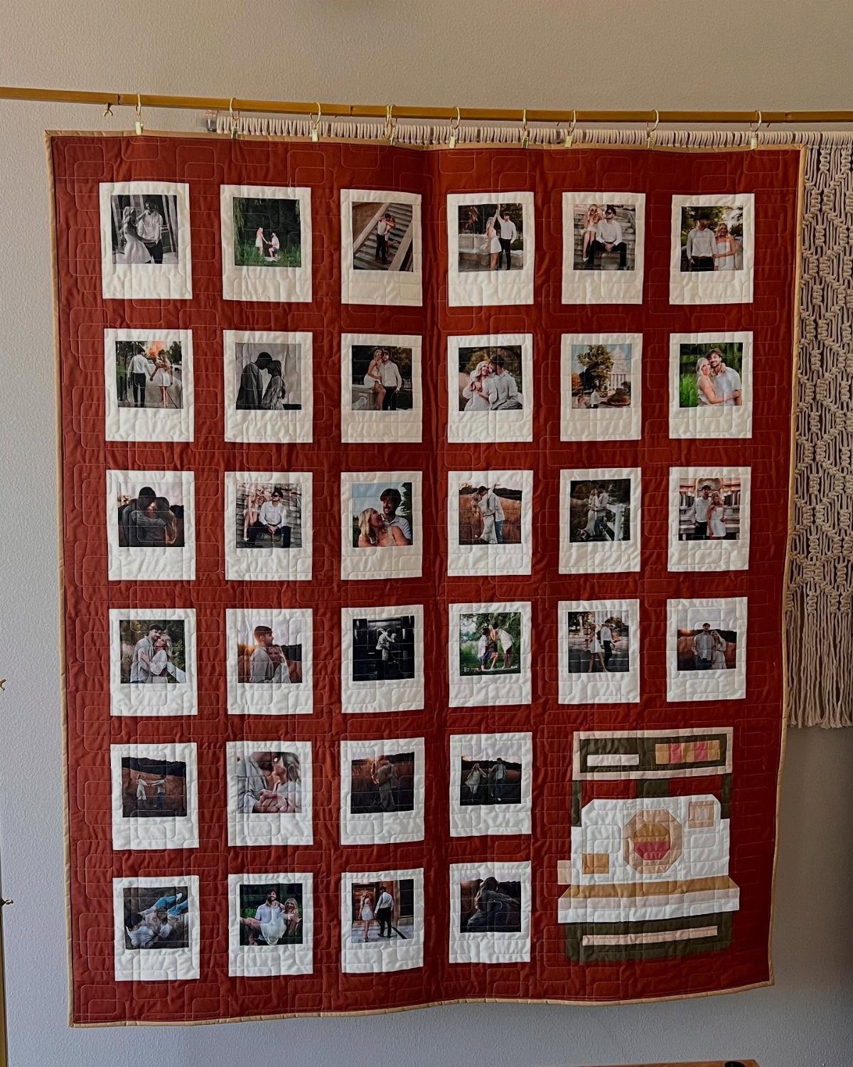 Red fabric quilt with a grid of printed couple photos sewn onto it.