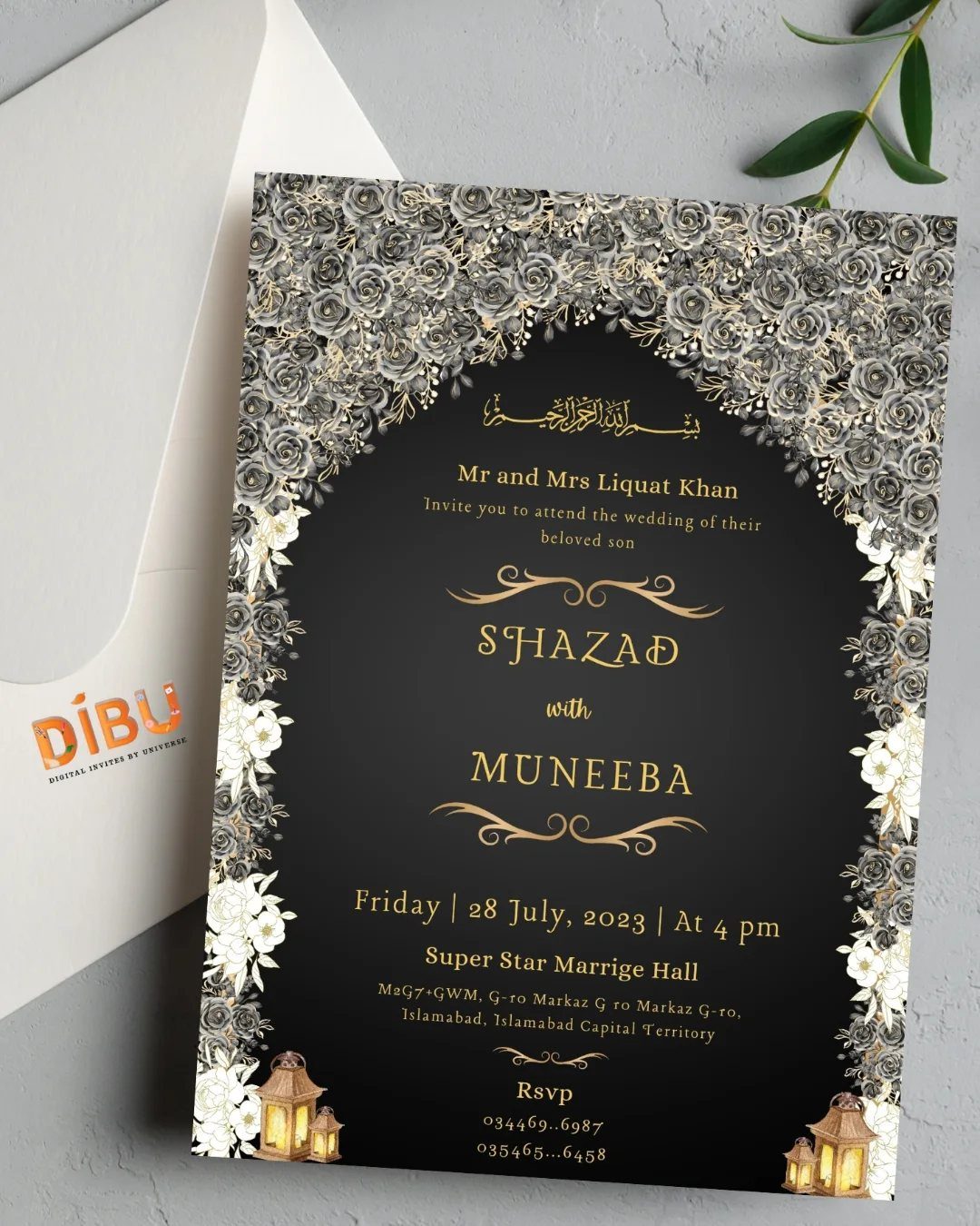 Black wedding invitation with gold lettering and silver floral borders on white envelope