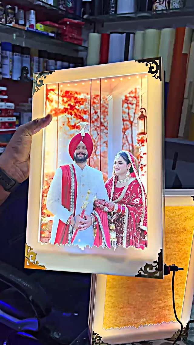 LED light frame featuring a photo of an Indian couple in wedding attire