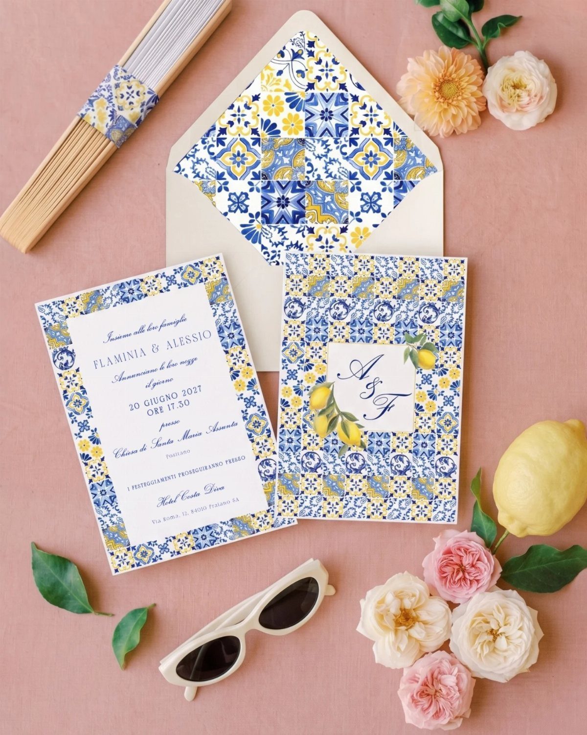 Wedding invitation and envelope featuring blue and yellow Majolica tile patterns with lemons.