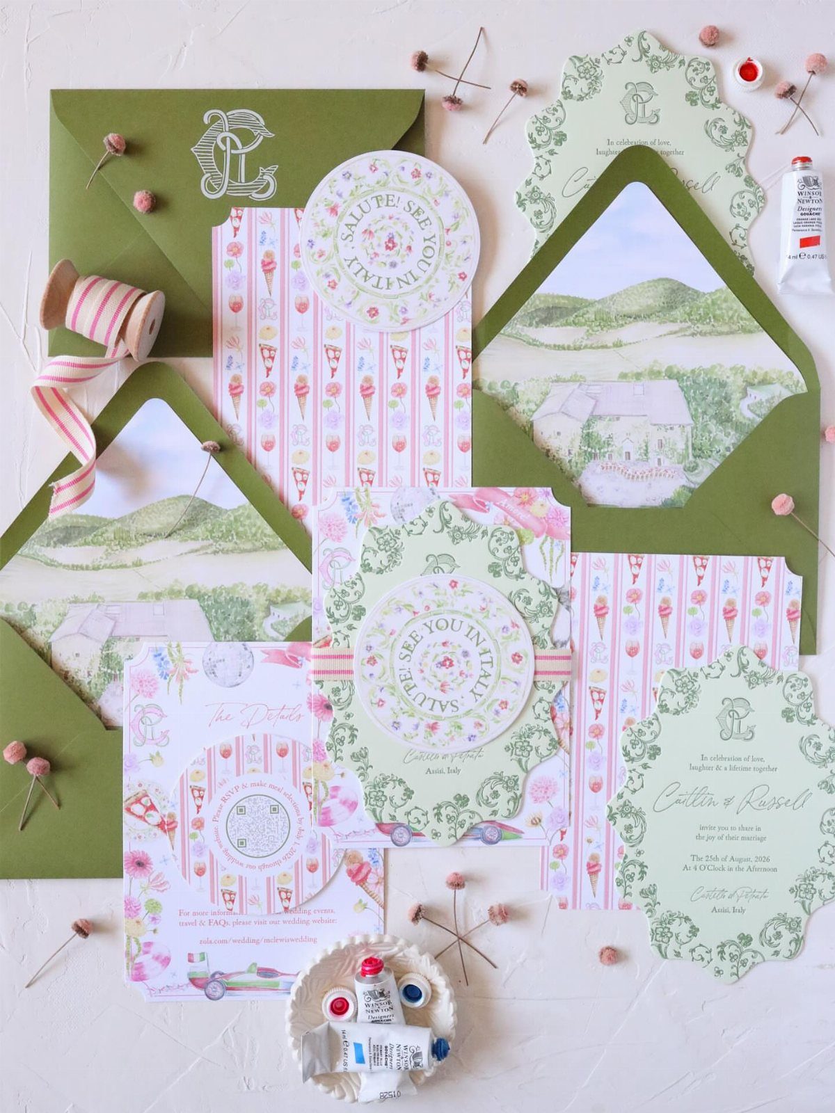 Wedding stationery set with green envelopes, watercolor illustrations, and pink striped cards.