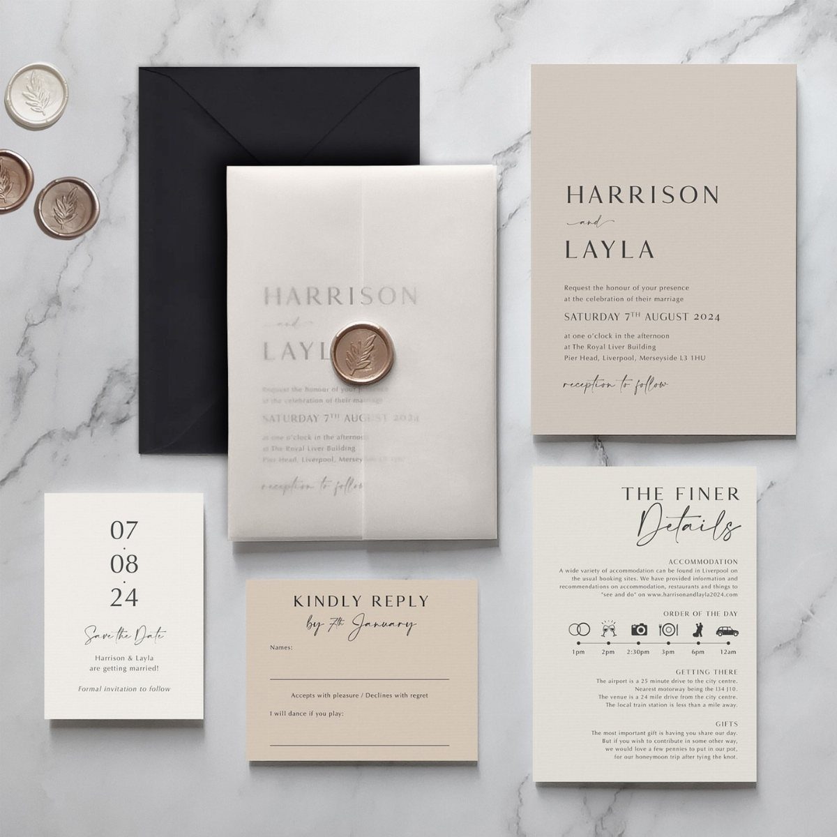 Wedding invitation suite with vellum overlay, wax seal, and beige and white cards.