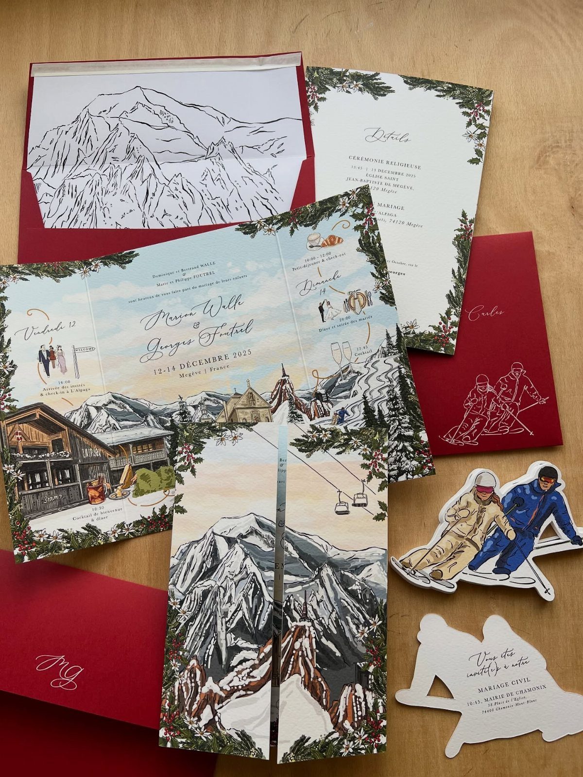 Winter mountain wedding invitation suite with snowy peaks, ski lodge, and skier cutouts.