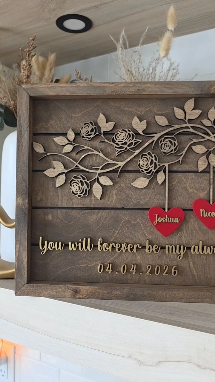 Wooden custom sign with carved roses, red hearts, and gold romantic text.