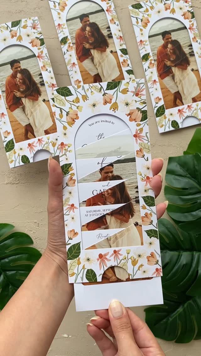 Interactive wedding invitation with a sliding photo reveal and floral decorations.