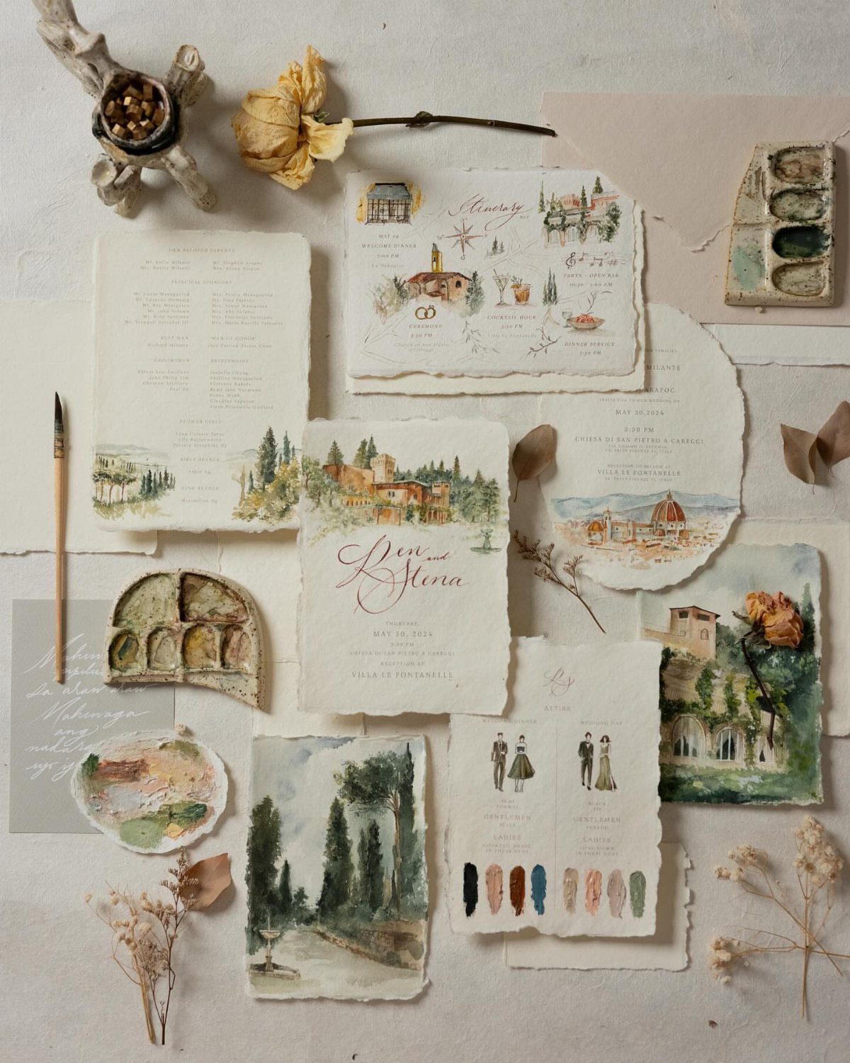 Watercolor wedding invitations featuring Italian landscapes and architecture on deckled edge paper.