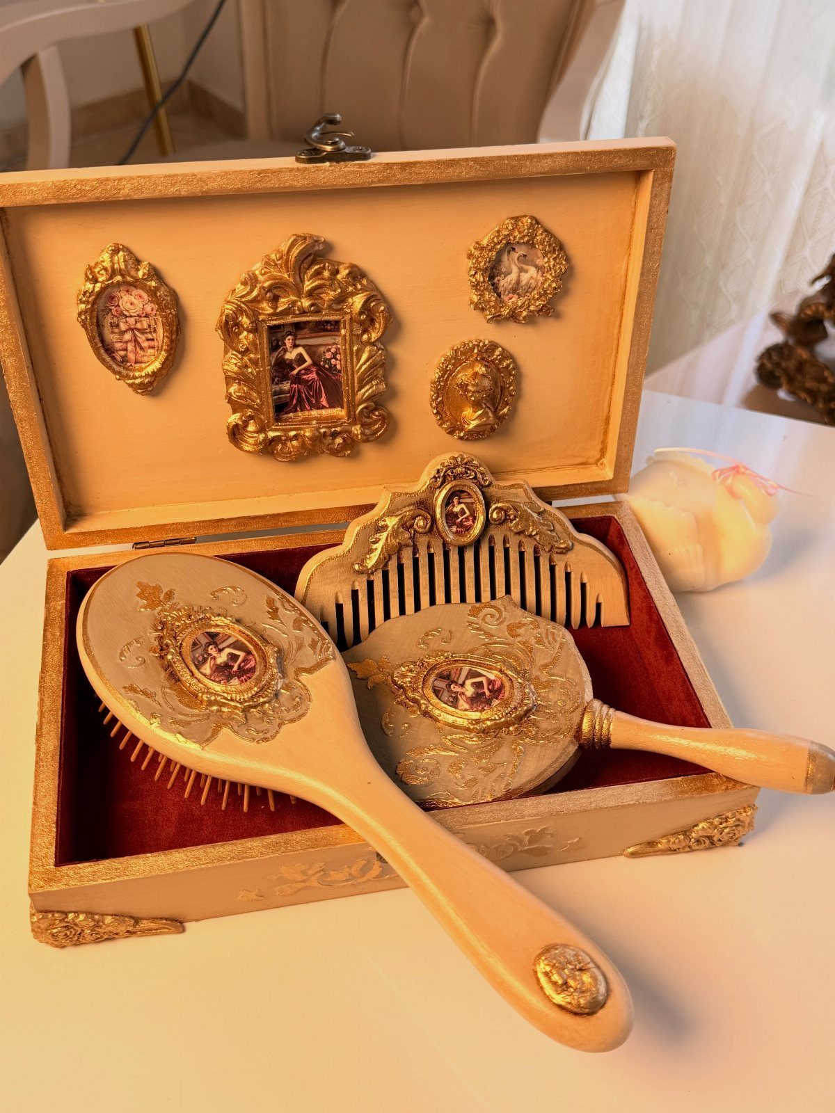 Vintage vanity set with brush, mirror, and comb in a wooden box.