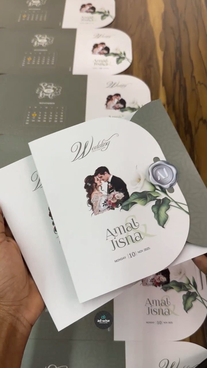 Arched white wedding invitation with couple illustration and floral details on wooden background