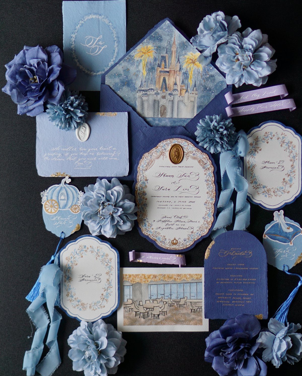 Blue wedding invitation suite with watercolor castle, wax seal, and blue fabric flowers.