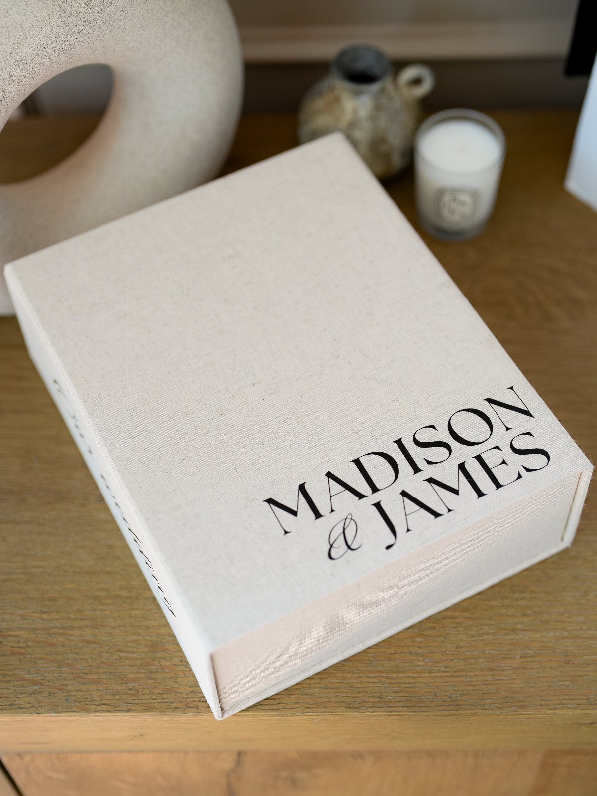 Cream linen keepsake box with Madison and James printed on the lid.