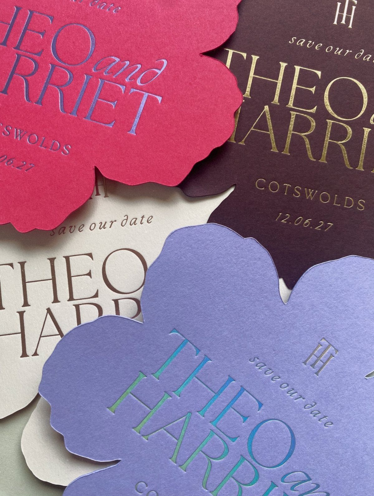 Elegant wedding save-the-date cards in various colors featuring sophisticated serif typography.